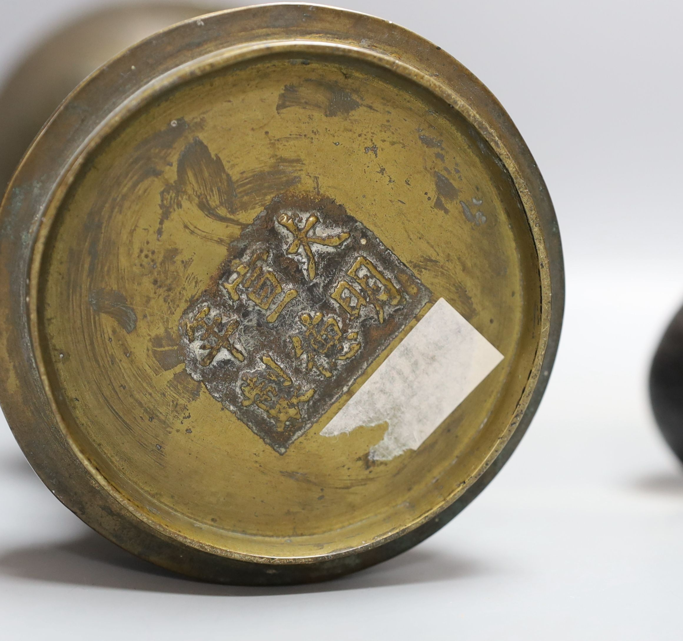 A Chinese bronze vase, 26cm high, inscription to base, together with a bronzed composition seated buddha figure
